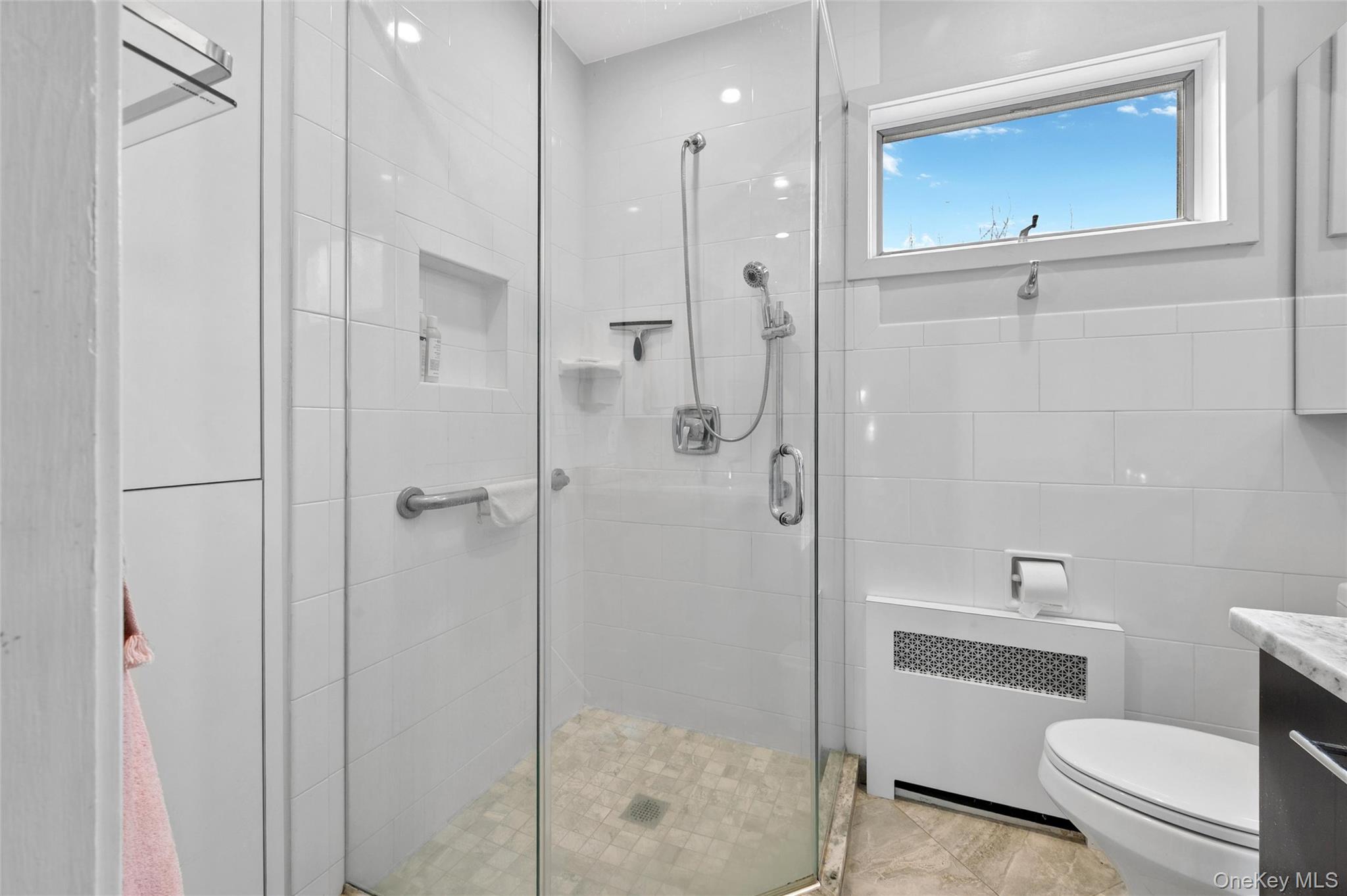 24 Allen Road Rockville Centre, NY 11570 - Photo 27 of 46 a bathroom with a shower a toilet and a sink