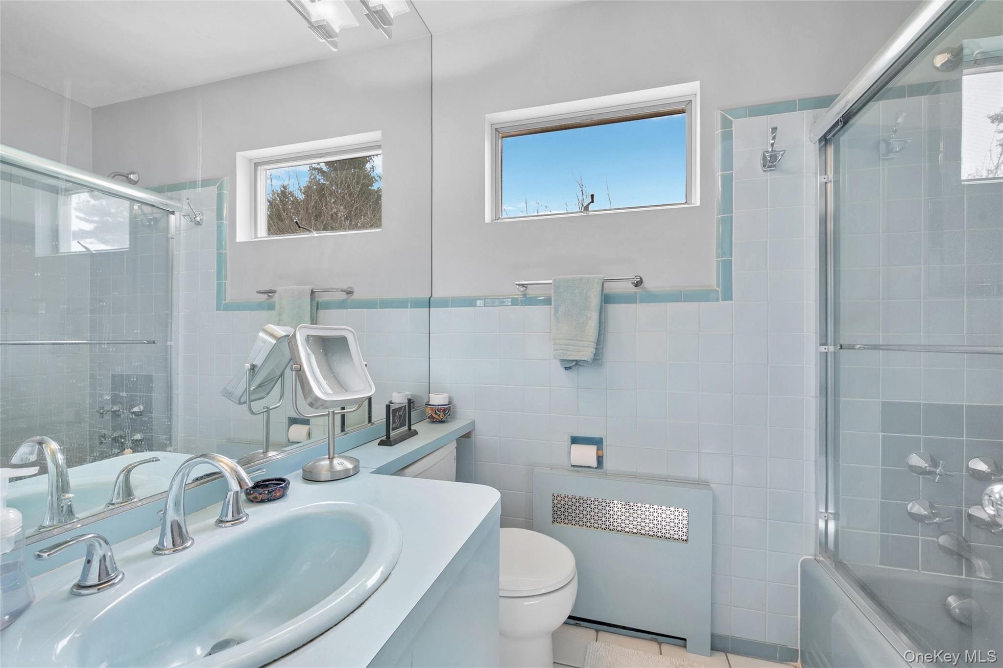 24 Allen Road Rockville Centre, NY 11570 - Photo 28 of 46 a bathroom with a sink toilet and shower