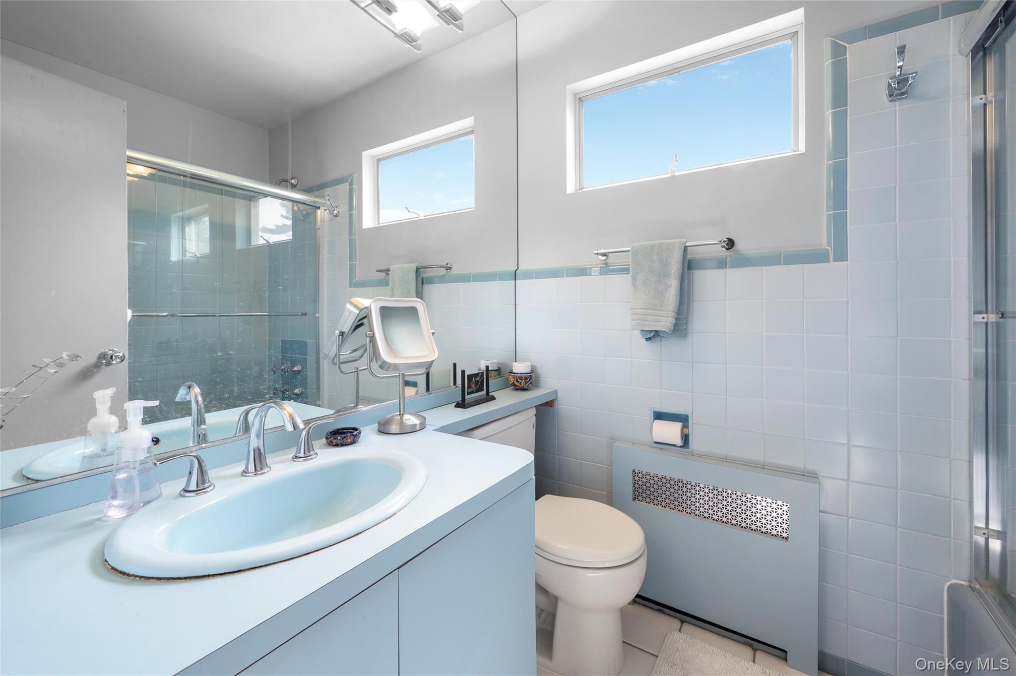 24 Allen Road Rockville Centre, NY 11570 - Photo 29 of 46 a bathroom with a sink toilet and shower