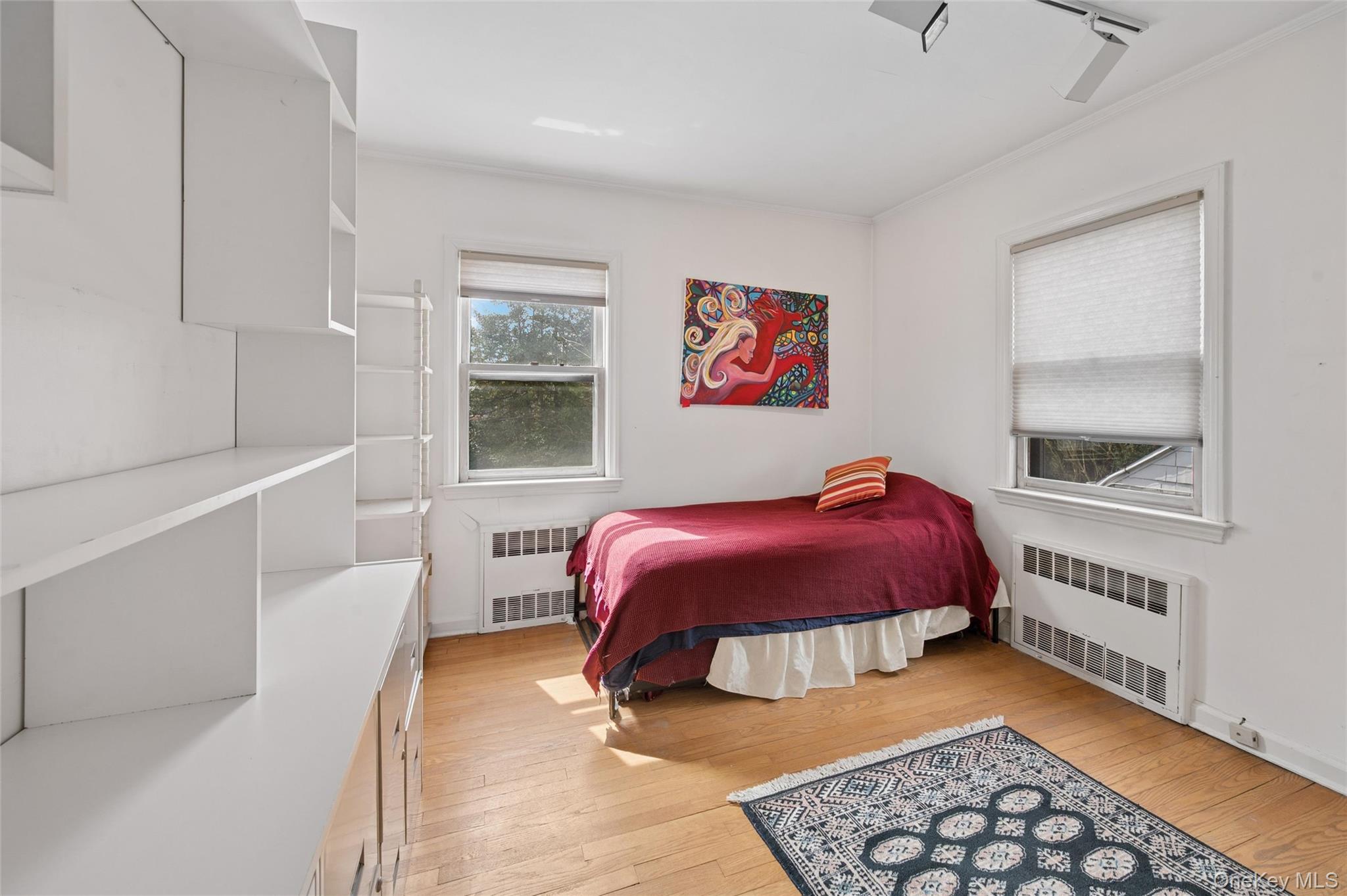 24 Allen Road Rockville Centre, NY 11570 - Photo 30 of 46 a bedroom with a bed and a window