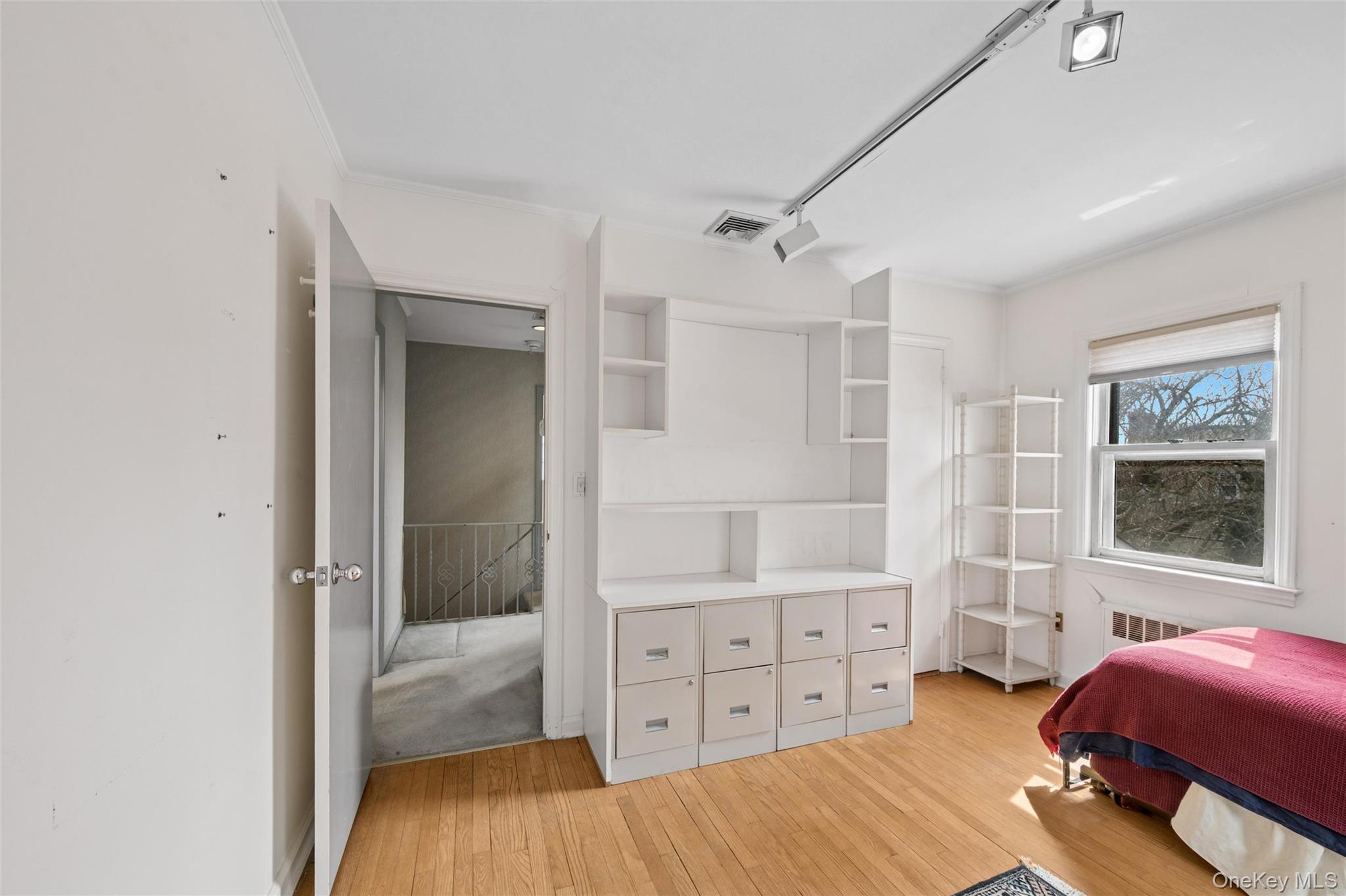 24 Allen Road Rockville Centre, NY 11570 - Photo 31 of 46 a bedroom with a bed and a window