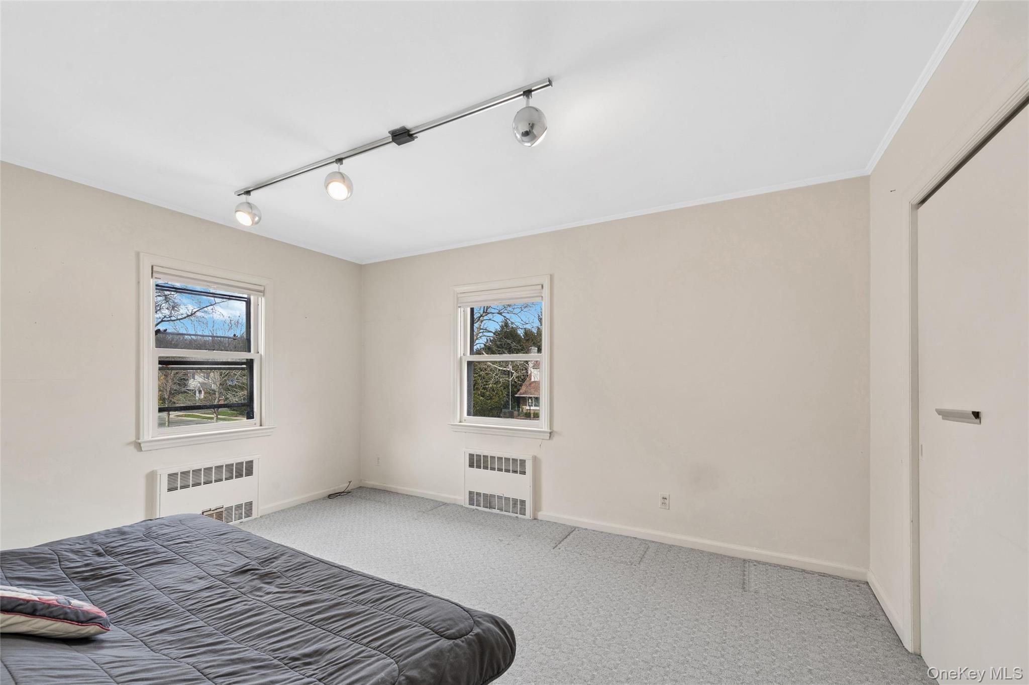 24 Allen Road Rockville Centre, NY 11570 - Photo 32 of 46 a bedroom with a bed and a window