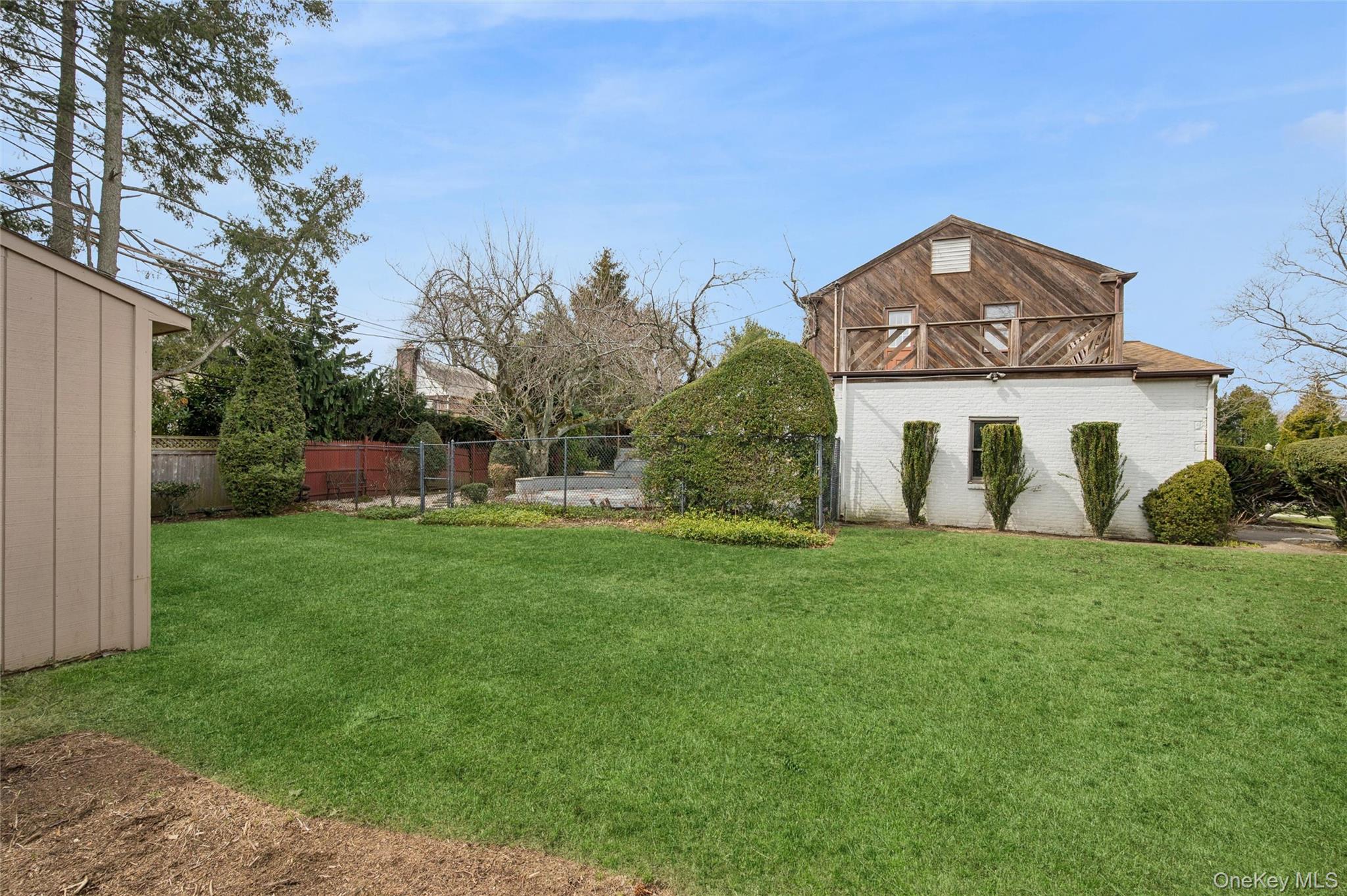 24 Allen Road Rockville Centre, NY 11570 - Photo 38 of 46 a view of a house with a yard and sitting area