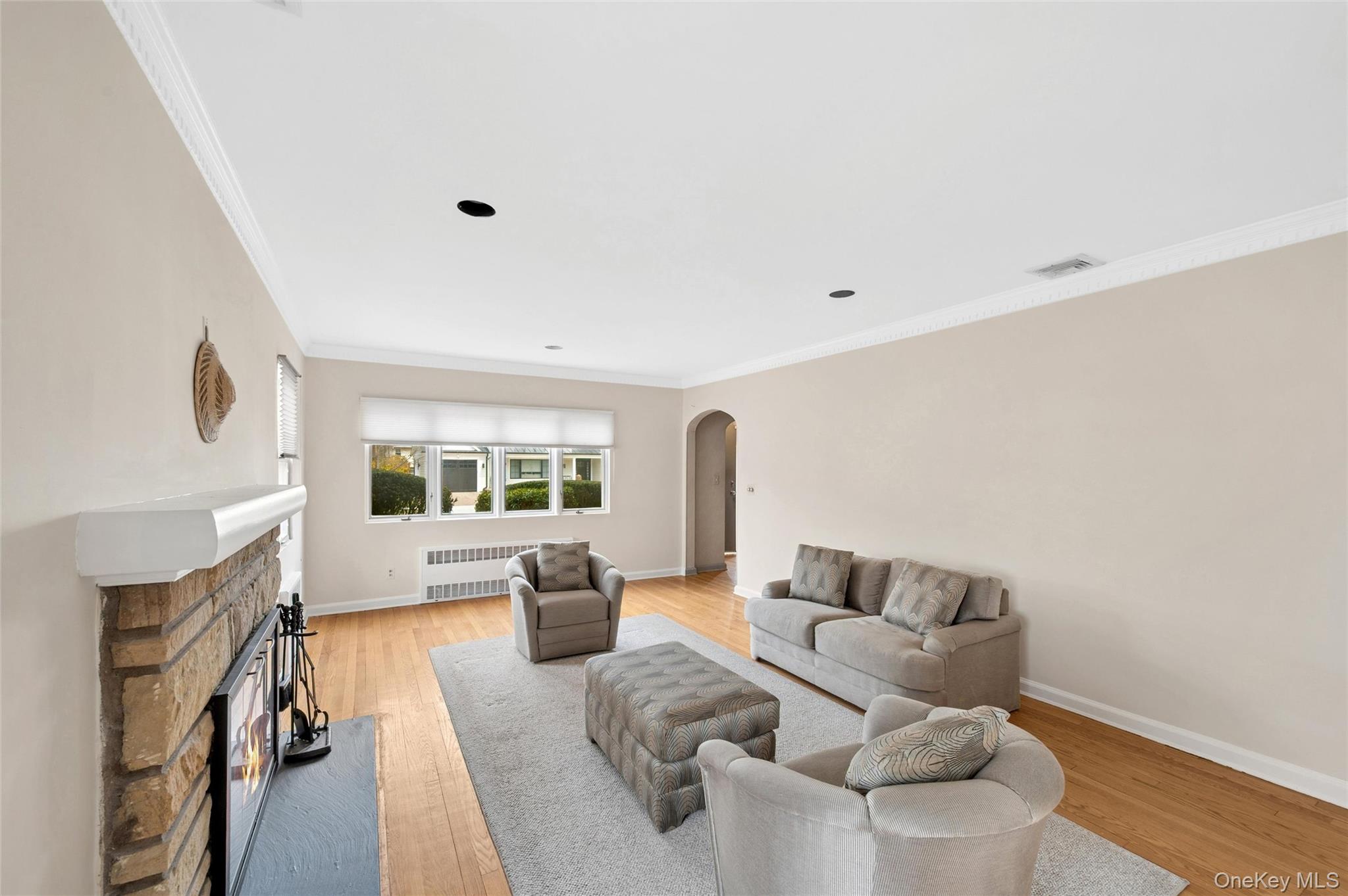 24 Allen Road Rockville Centre, NY 11570 - Photo 4 of 46 a living room with furniture large window and wooden floor