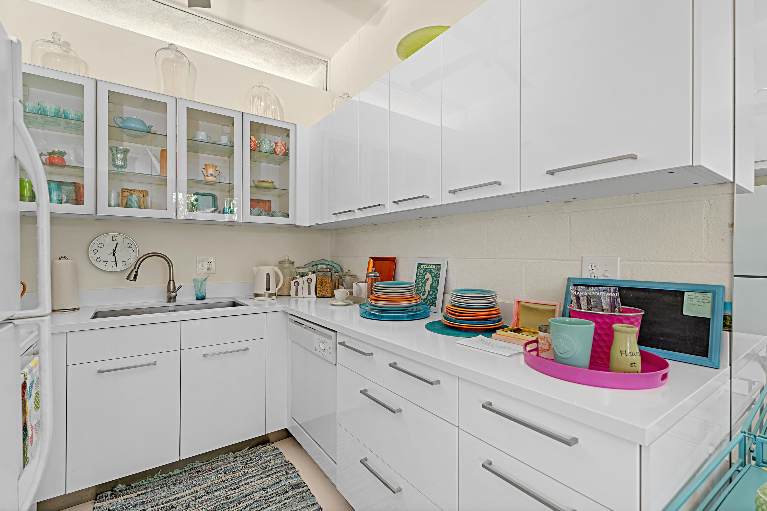 45301 Deep Canyon Road, Unit 21 Palm Desert, CA 92260 - Photo 12 of 46 a kitchen with cabinets and window
