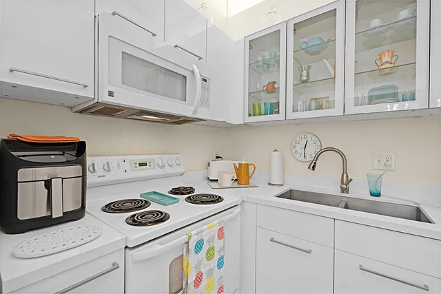 a kitchen with a stove and a microwave