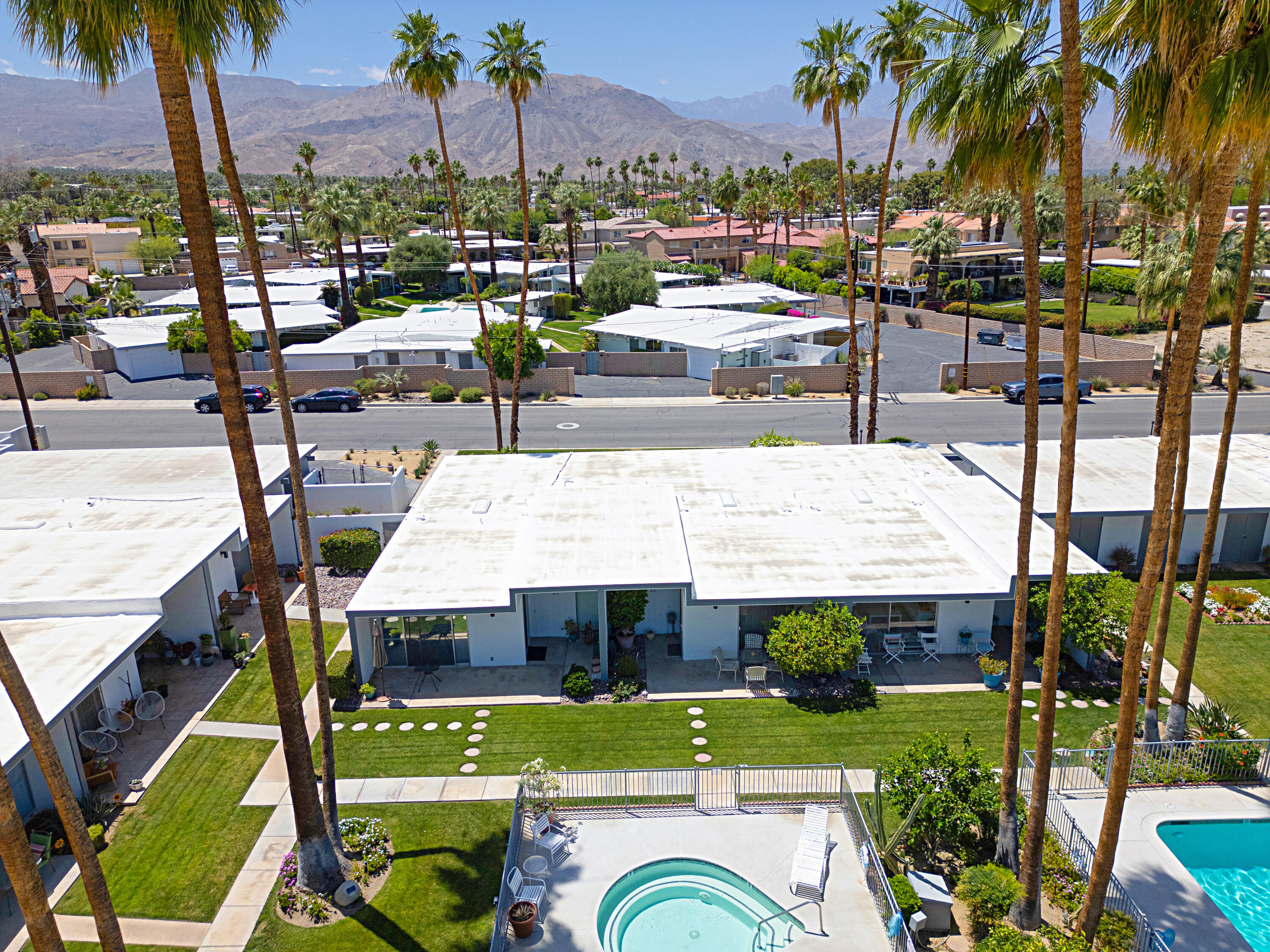 45301 Deep Canyon Road, Unit 21 Palm Desert, CA 92260 - Photo 37 of 46 a view of a swimming pool and chairs