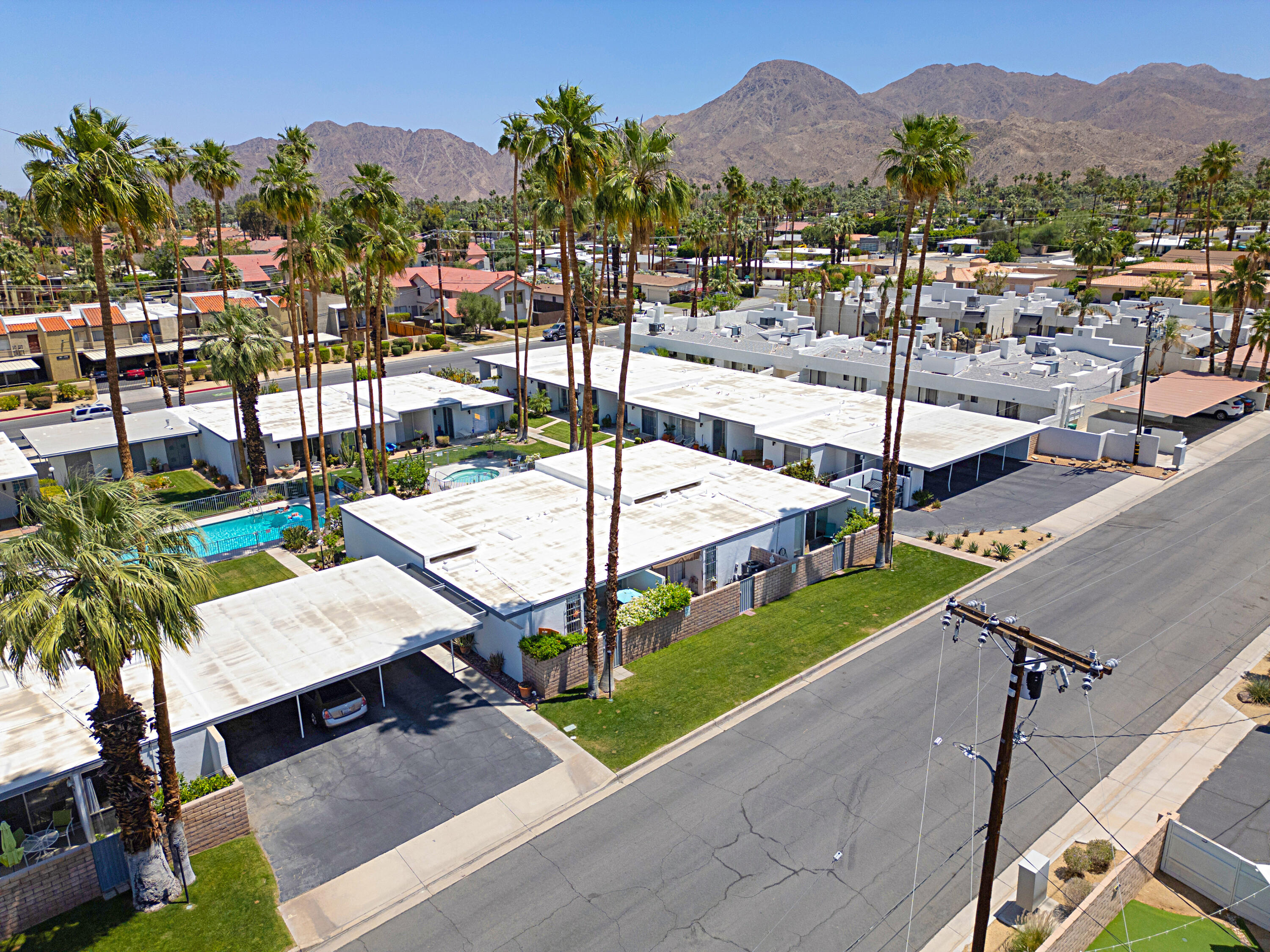 45301 Deep Canyon Road, Unit 21 Palm Desert, CA 92260 - Photo 38 of 46 a view of a patio with a table and chairs