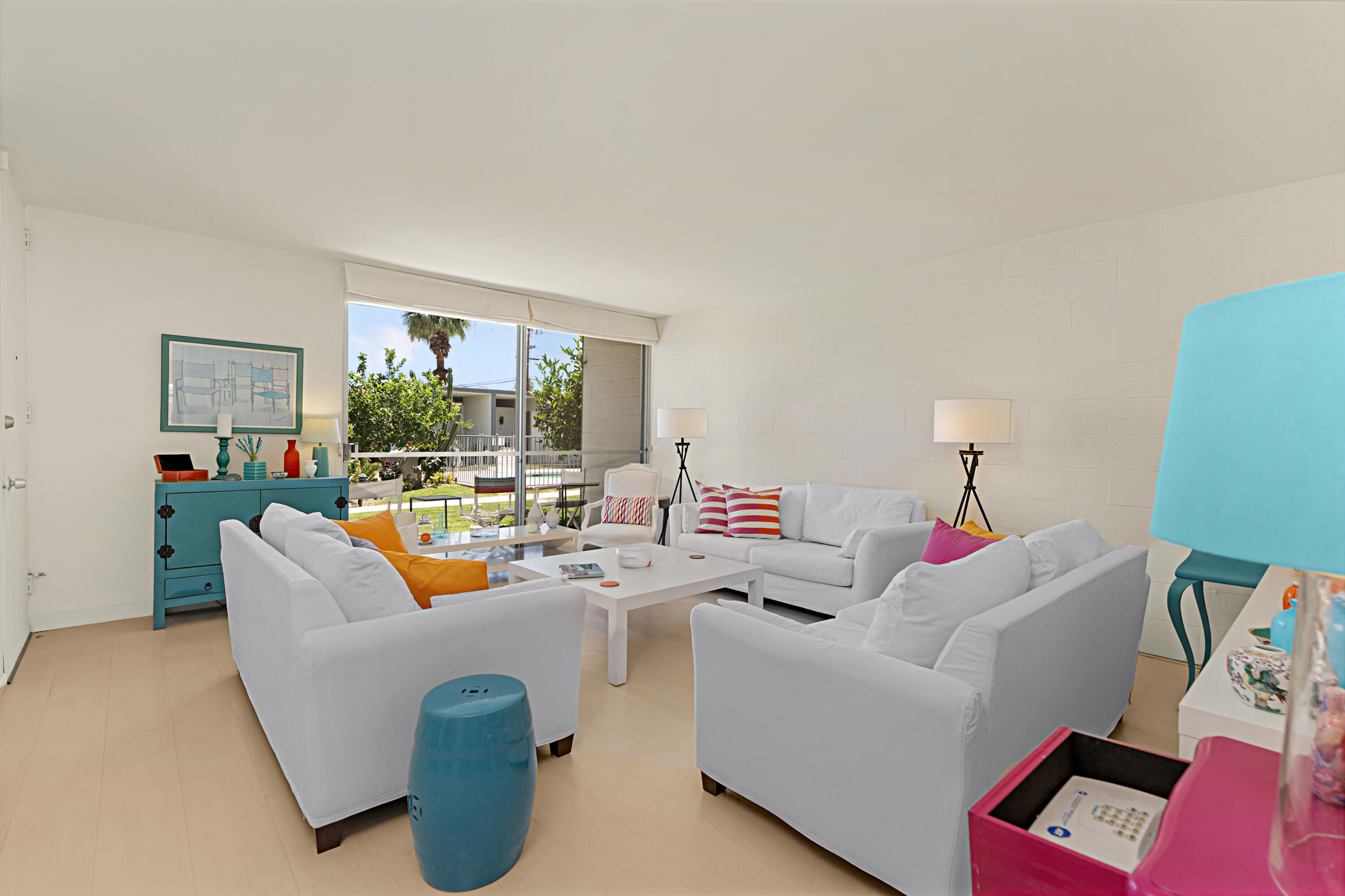 45301 Deep Canyon Road, Unit 21 Palm Desert, CA 92260 - Photo 7 of 46 a living room with furniture and a large window
