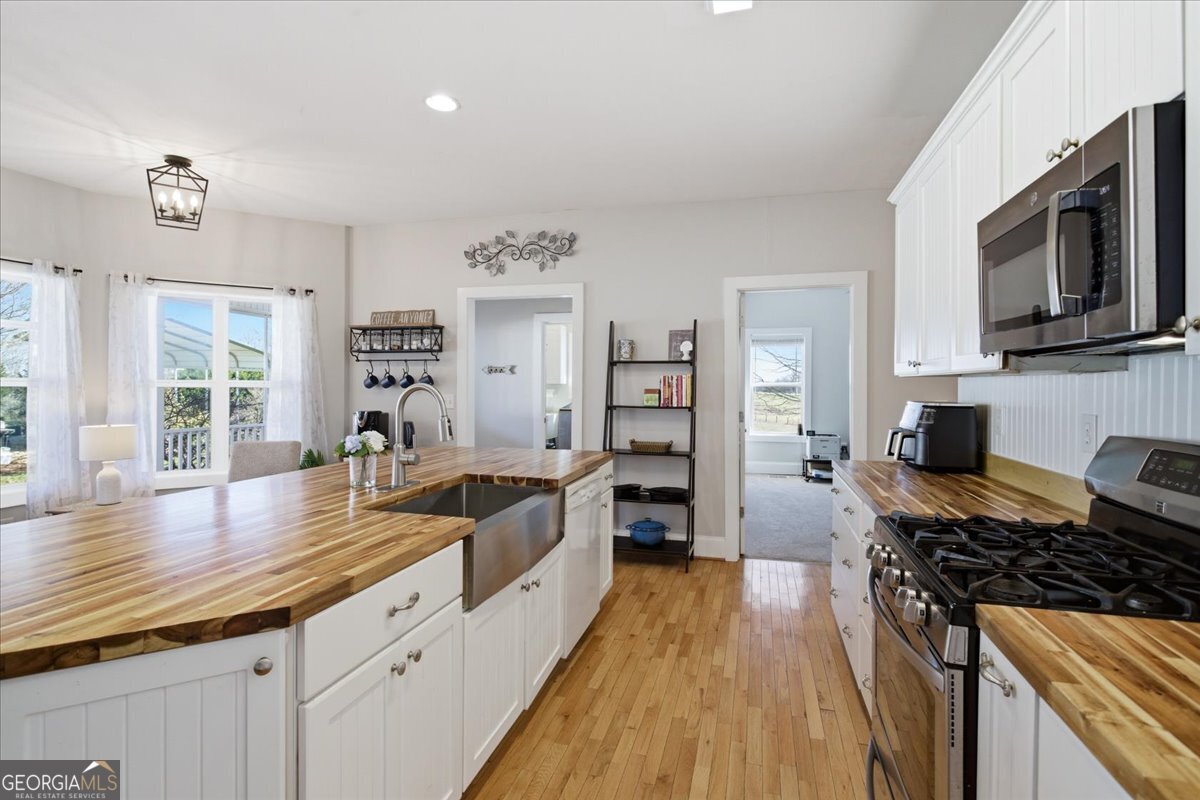 204 Staples Dairy Road Carrollton, GA 30116 - Photo 17 of 85 a kitchen with granite countertop a sink cabinets and stainless steel appliances