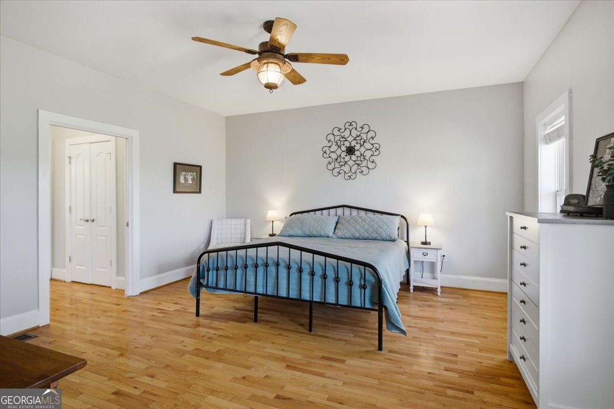 204 Staples Dairy Road Carrollton, GA 30116 - Photo 19 of 85 a bedroom with a bed and a chandelier