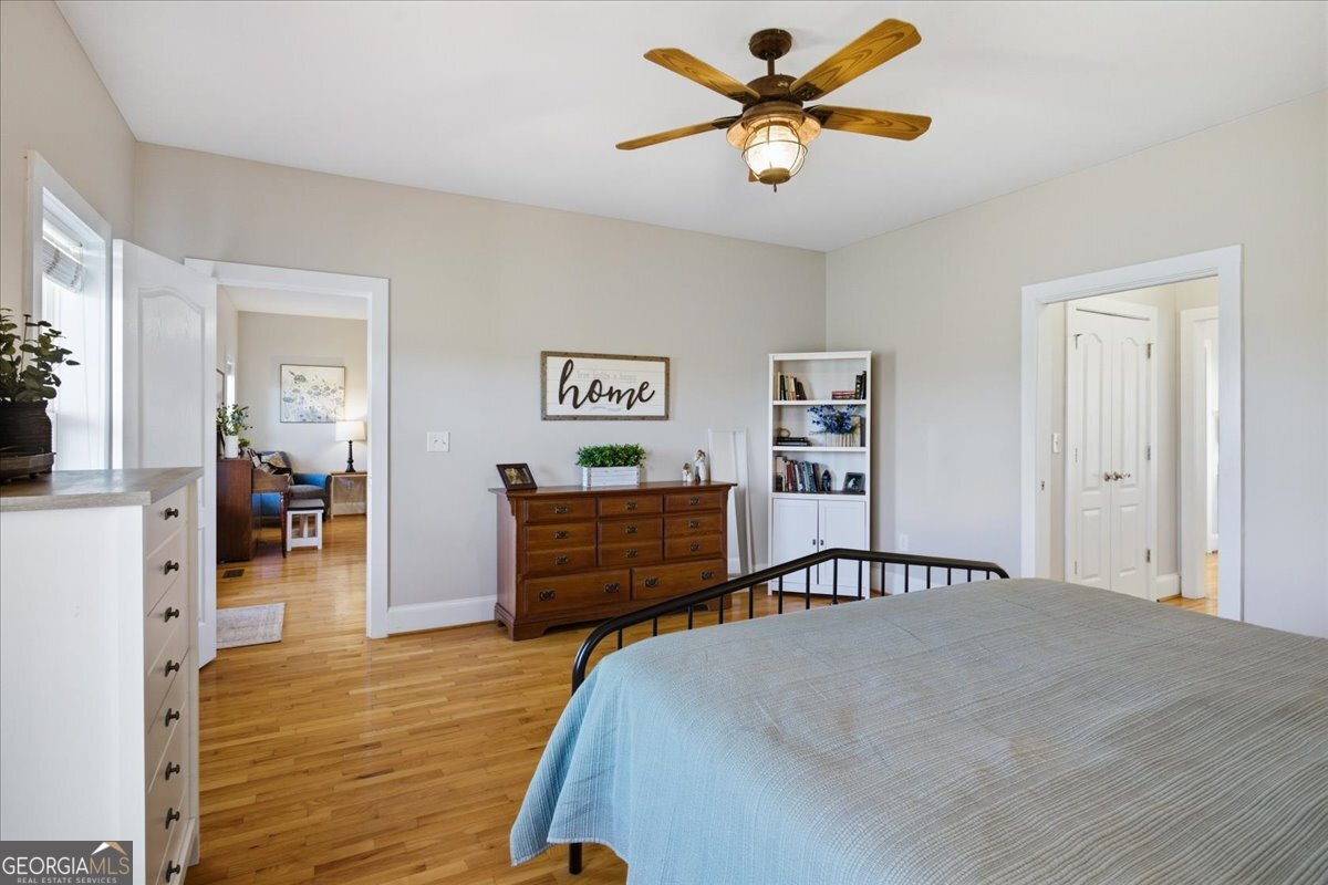 204 Staples Dairy Road Carrollton, GA 30116 - Photo 20 of 85 a bedroom with a bed and a chandelier