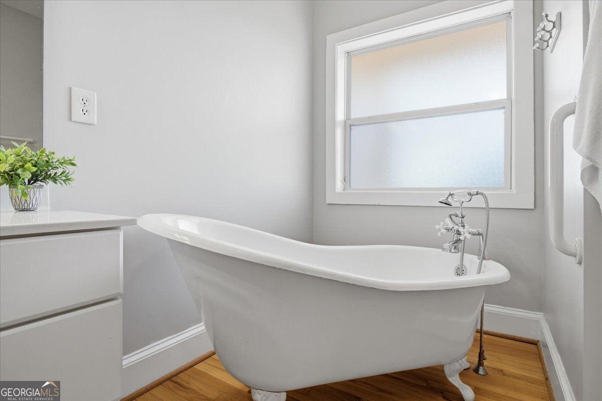 204 Staples Dairy Road Carrollton, GA 30116 - Photo 25 of 85 a bathroom with a sink and a window