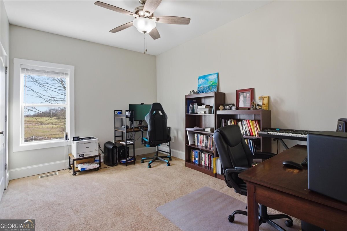204 Staples Dairy Road Carrollton, GA 30116 - Photo 30 of 85 a view of a workspace with furniture and a window