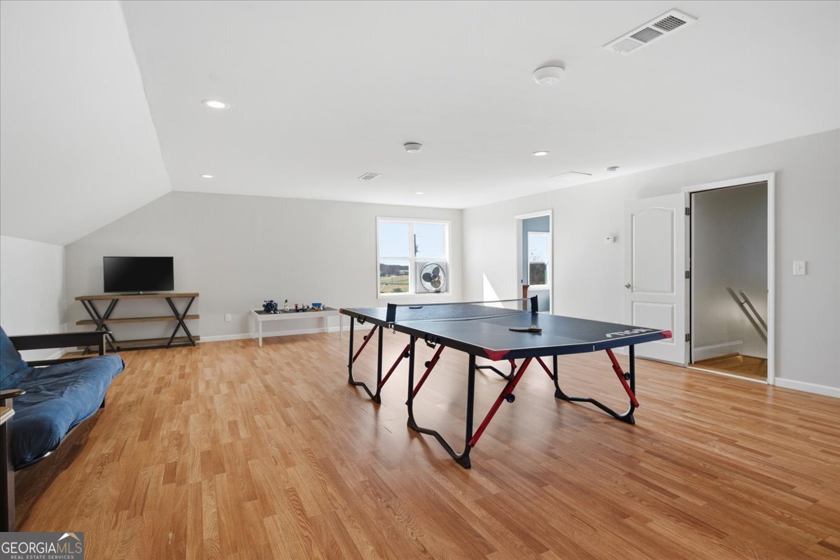 204 Staples Dairy Road Carrollton, GA 30116 - Photo 37 of 85 a living room with dining room and wooden floor