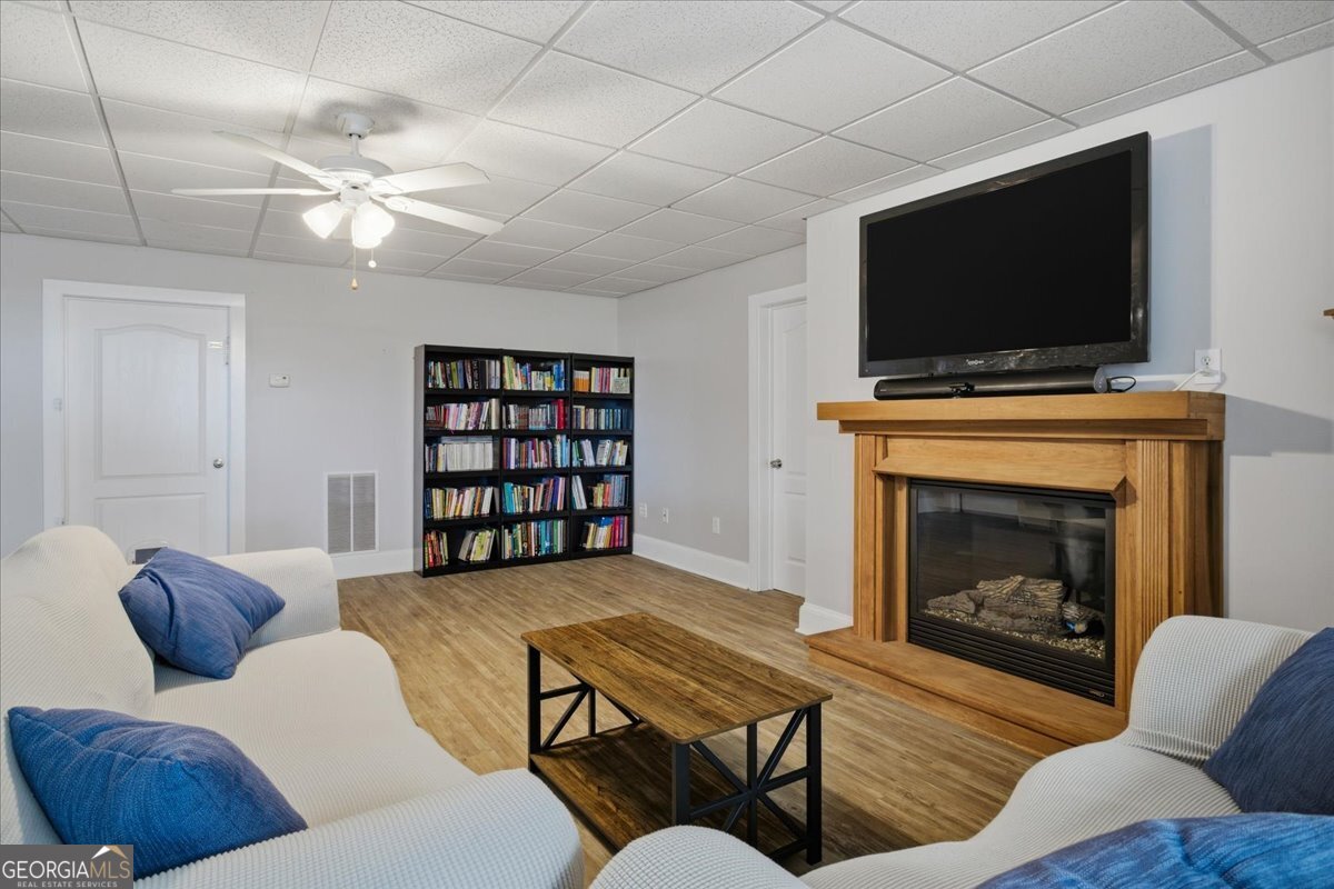 204 Staples Dairy Road Carrollton, GA 30116 - Photo 45 of 85 a living room with furniture and a flat screen tv
