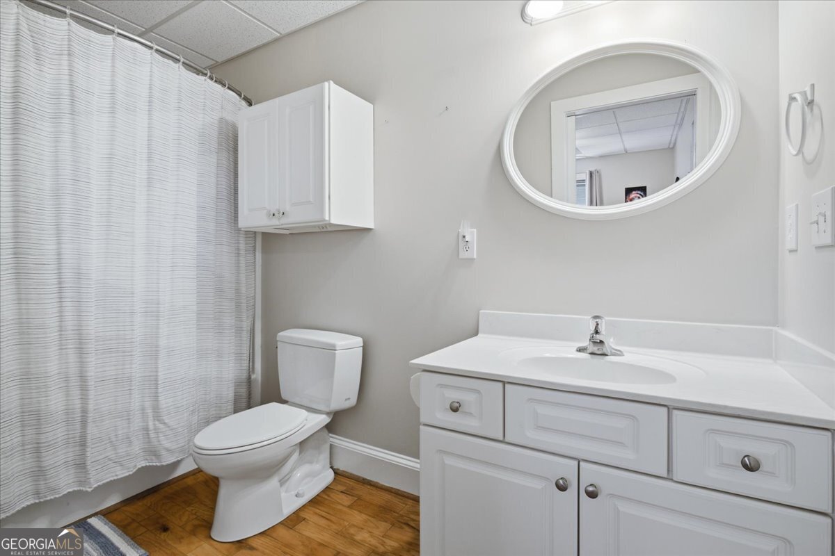 204 Staples Dairy Road Carrollton, GA 30116 - Photo 51 of 85 a bathroom with a toilet sink and mirror