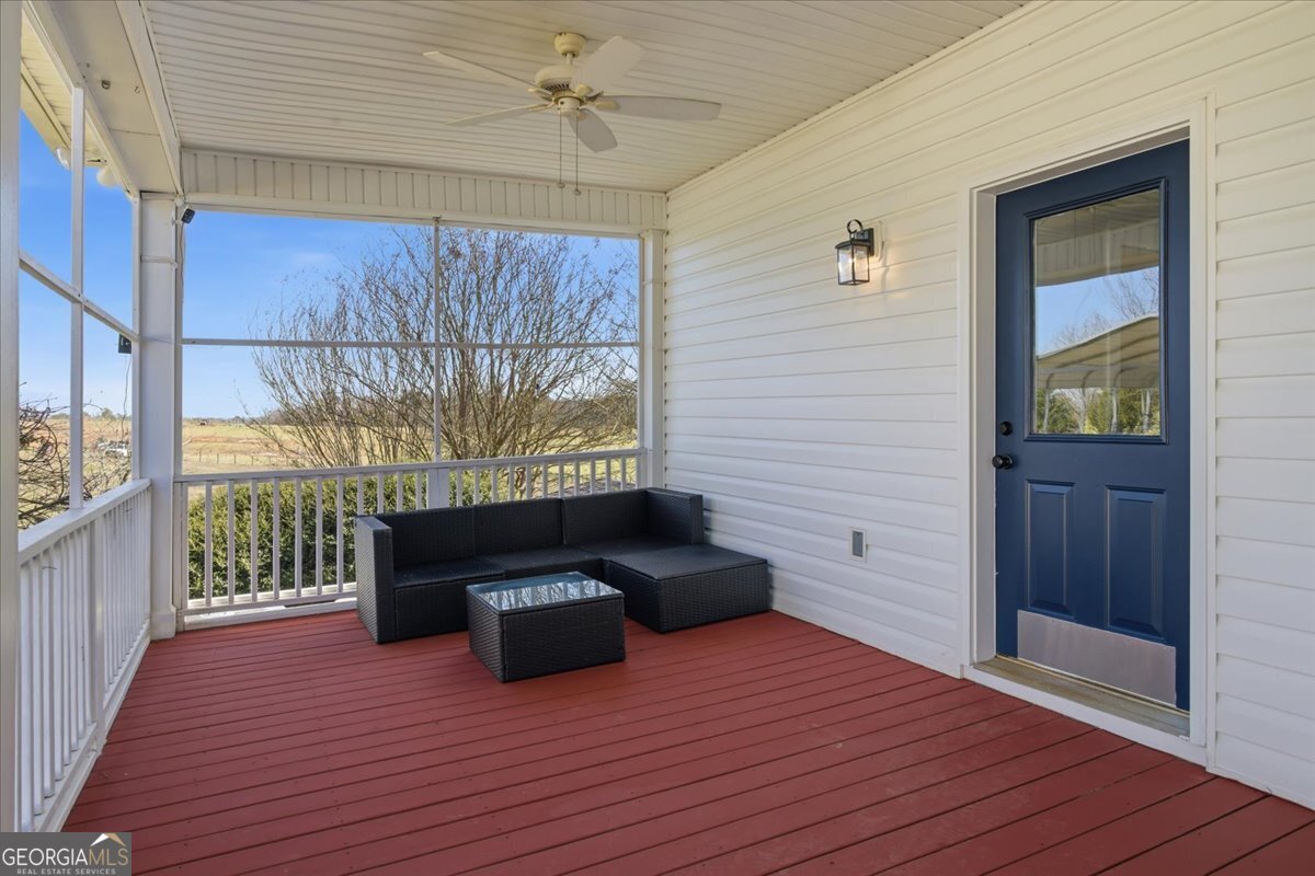 204 Staples Dairy Road Carrollton, GA 30116 - Photo 67 of 85 a view of a balcony with furniture and wooden floor