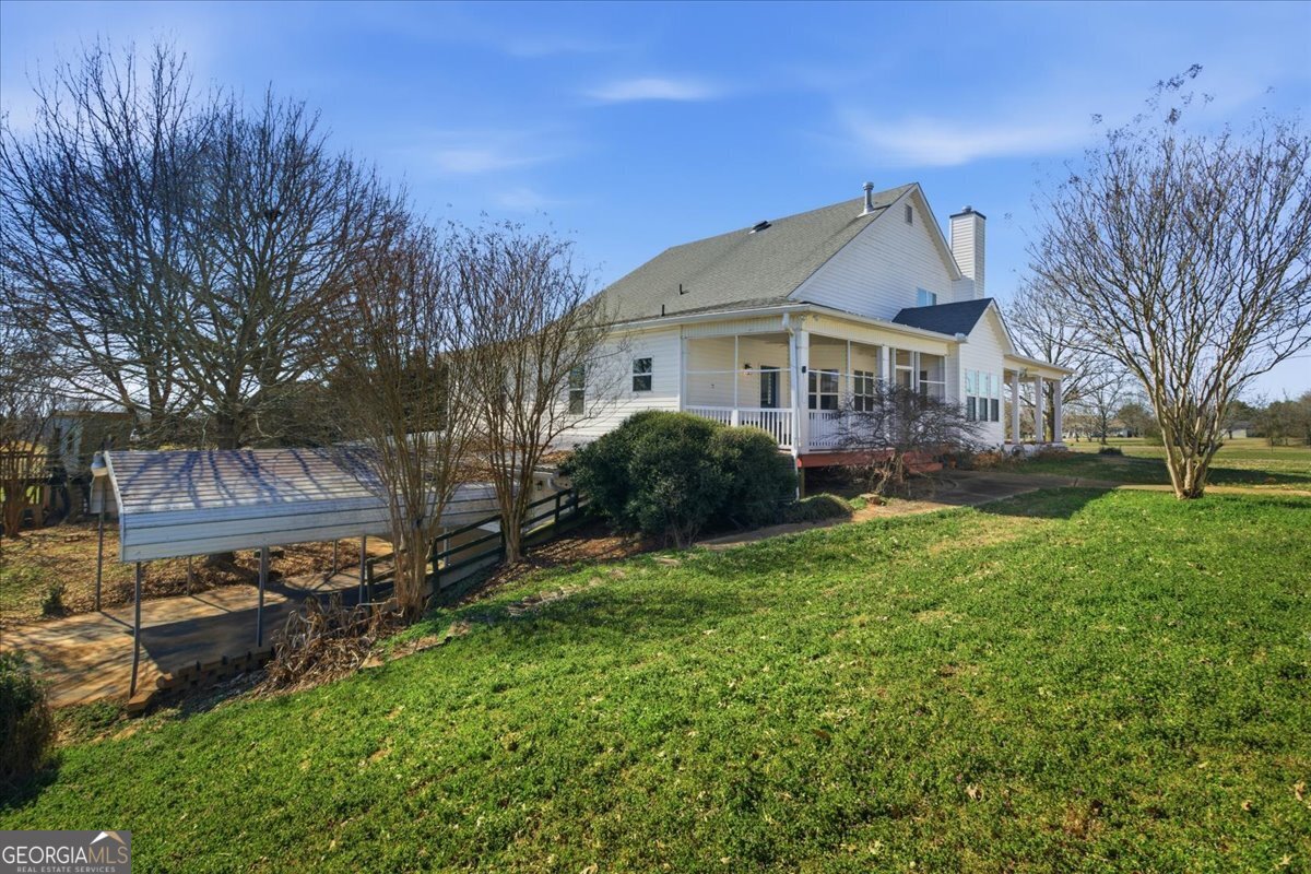 204 Staples Dairy Road Carrollton, GA 30116 - Photo 69 of 85 a view of a house with a big yard plants and large trees