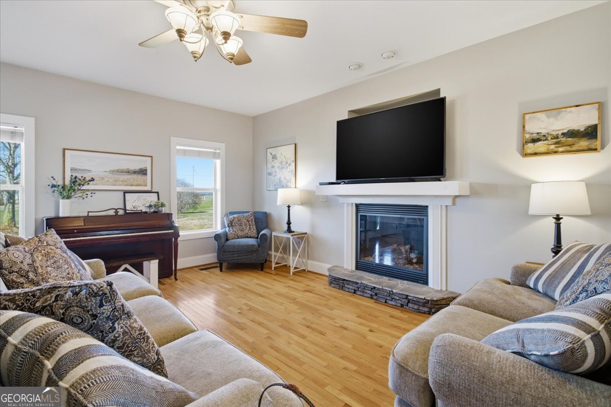 204 Staples Dairy Road Carrollton, GA 30116 - Photo 7 of 85 a living room with furniture a fireplace and a flat screen tv
