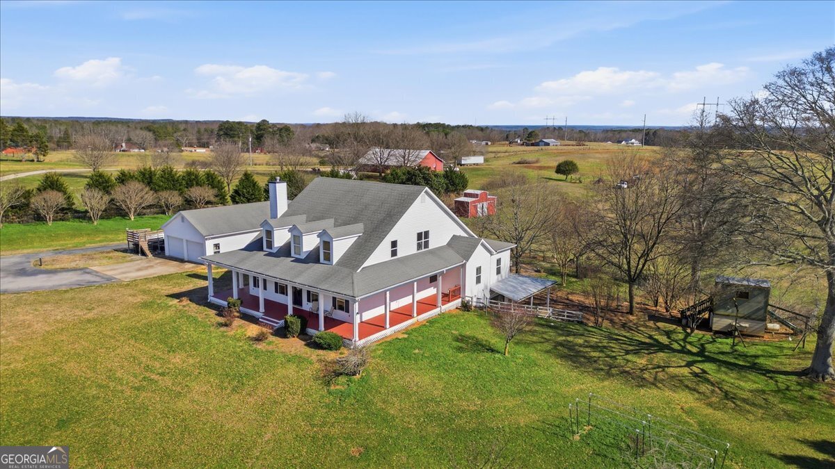 204 Staples Dairy Road Carrollton, GA 30116 - Photo 78 of 85 an aerial view of a house with a garden and lake view