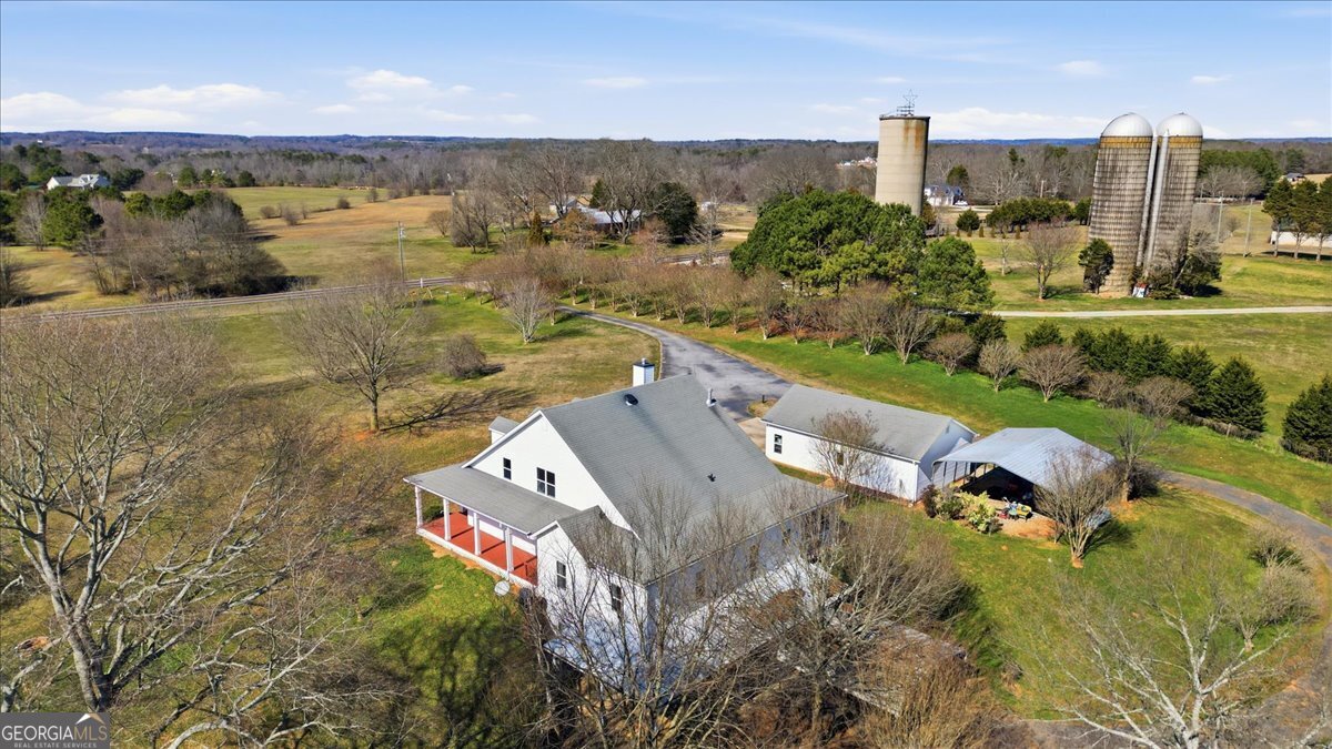 204 Staples Dairy Road Carrollton, GA 30116 - Photo 81 of 85 an aerial view of a city with lots of residential buildings ocean and mountain view in back