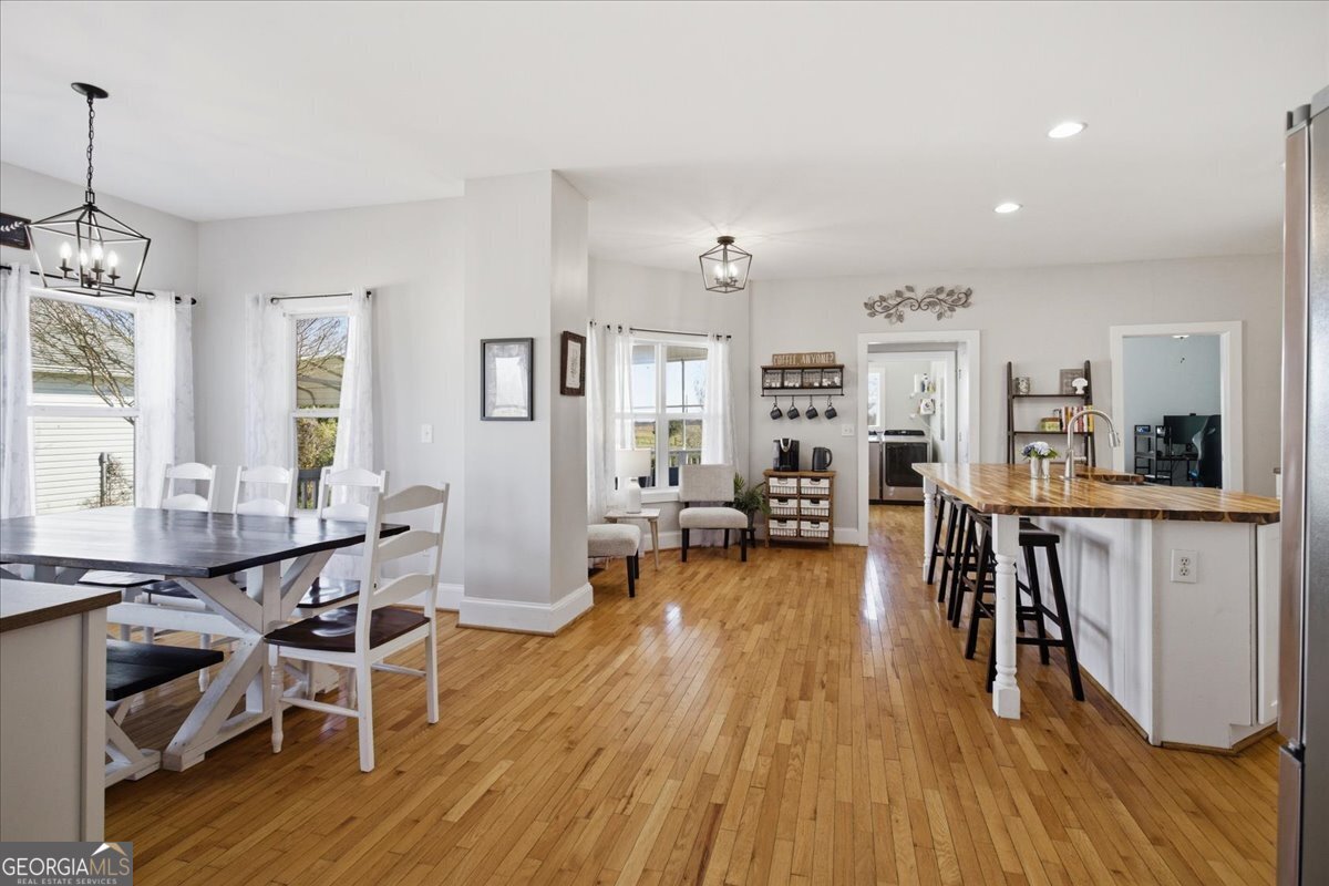 204 Staples Dairy Road Carrollton, GA 30116 - Photo 9 of 85 a view of a dining room with furniture and wooden floor