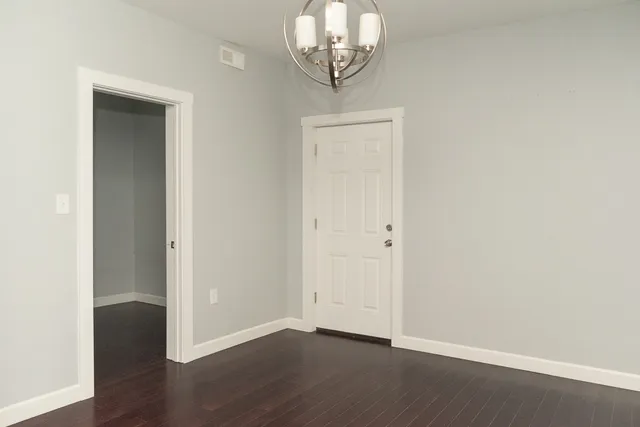a kitchen with a sink cabinets stainless steel appliances and a window