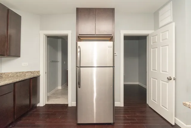 a view of hallway with wooden floor