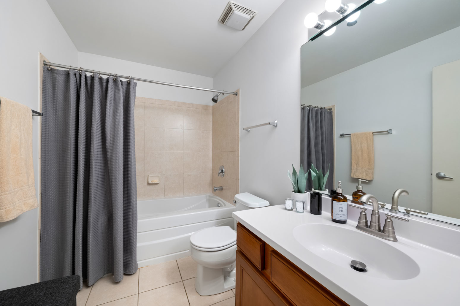 849 North Franklin Street, Unit 715 Chicago, IL 60610 - Photo 14 of 26 a bathroom with a sink a toilet a mirror and shower