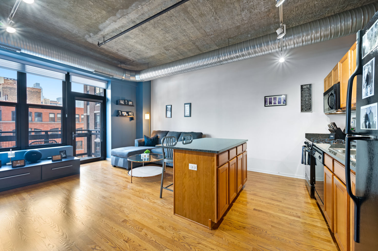 849 North Franklin Street, Unit 715 Chicago, IL 60610 - Photo 4 of 26 a kitchen with stainless steel appliances granite countertop a stove and cabinets