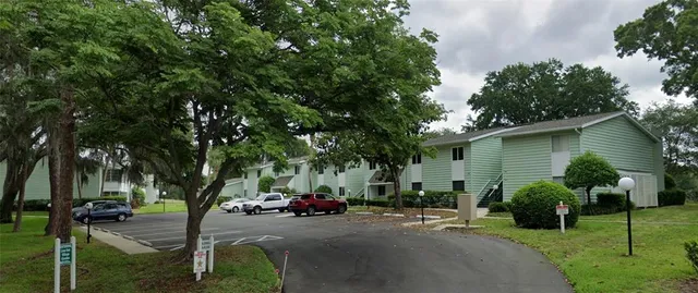 a view of a car parked in front of a house