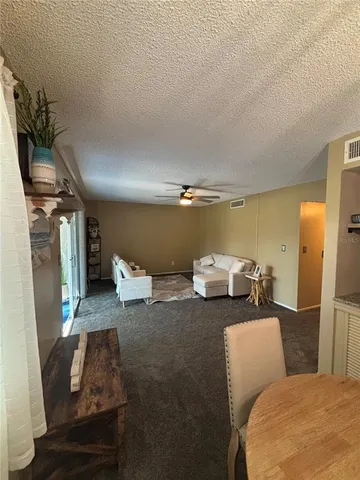 a couple of chairs sitting in a room next to a window