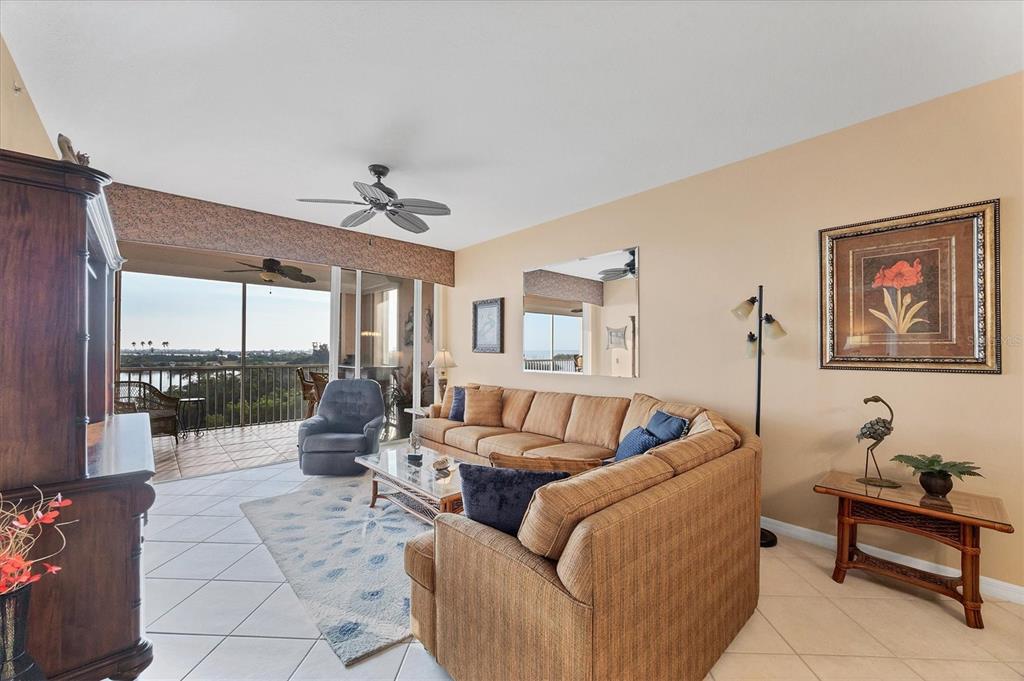 13113 Gasparilla Road, Unit 403 Placida, FL 33946 - Photo 16 of 53 a living room with furniture a rug and a chandelier