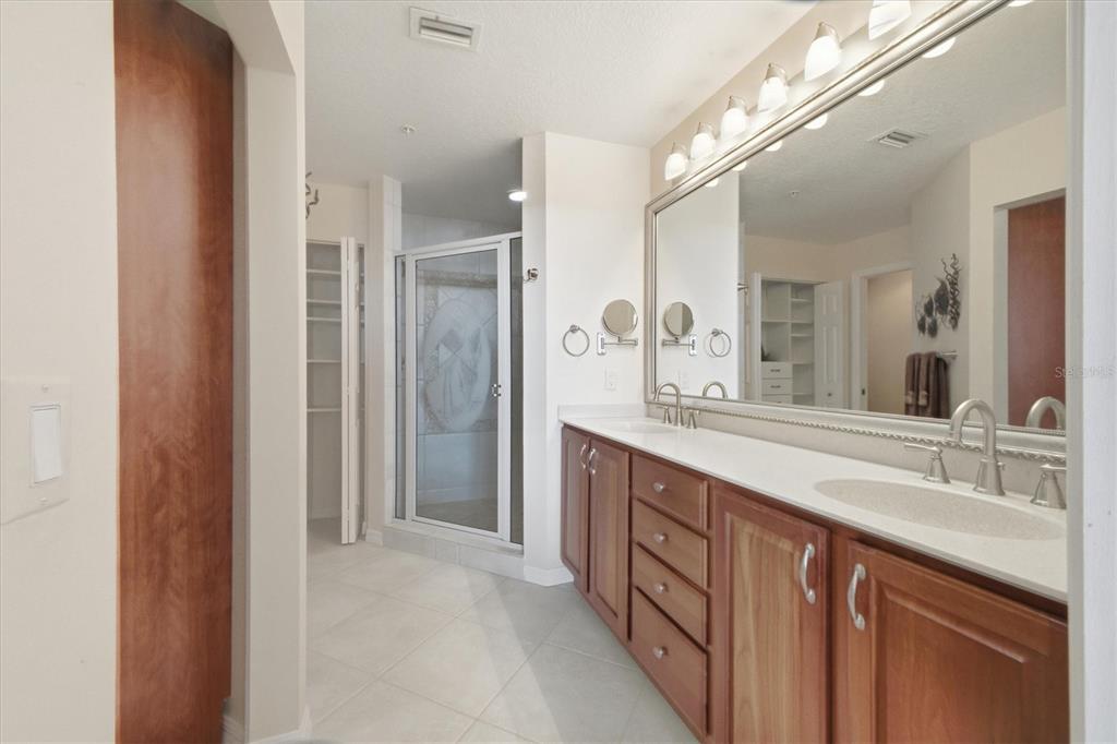 13113 Gasparilla Road, Unit 403 Placida, FL 33946 - Photo 24 of 53 a spacious bathroom with a double vanity sink mirror and double