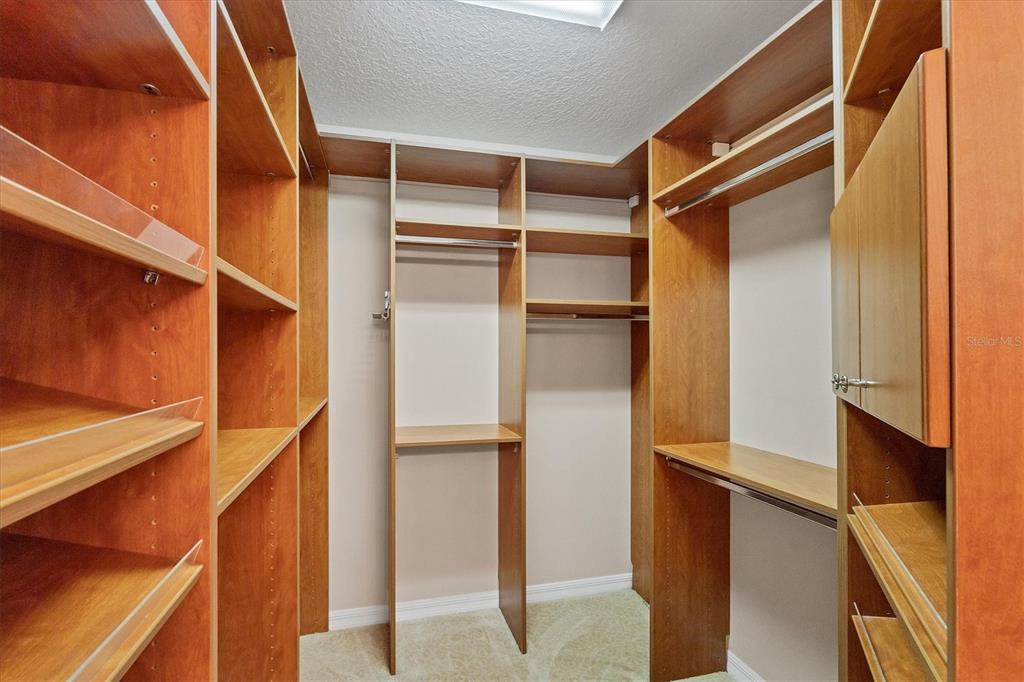 13113 Gasparilla Road, Unit 403 Placida, FL 33946 - Photo 27 of 53 a view of walk in closet with empty racks