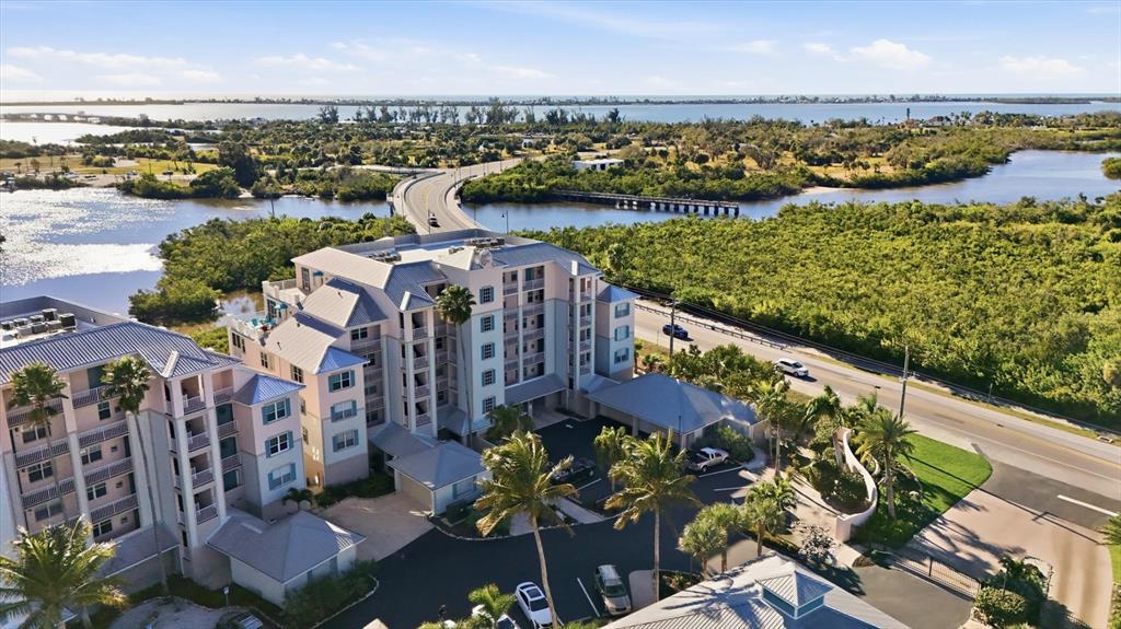 13113 Gasparilla Road, Unit 403 Placida, FL 33946 - Photo 44 of 53 a view of a lake with a table and chairs