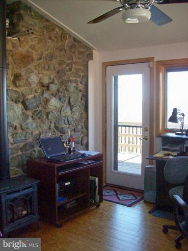 1704 Dahlgren Road Middletown, MD 21769 - Photo 12 of 17 a room with a desk and chair with windows