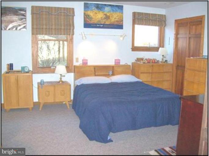 1704 Dahlgren Road Middletown, MD 21769 - Photo 3 of 17 a large bed sitting in a bedroom next to a window
