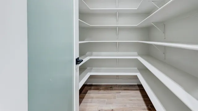 a view of staircase with white walls and a window