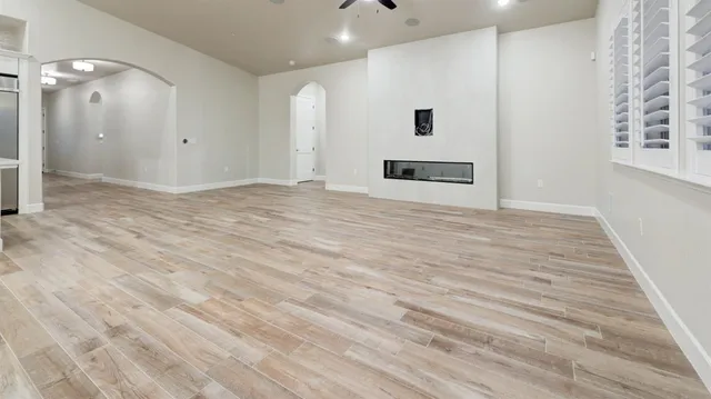 a view of a livingroom with wooden floor