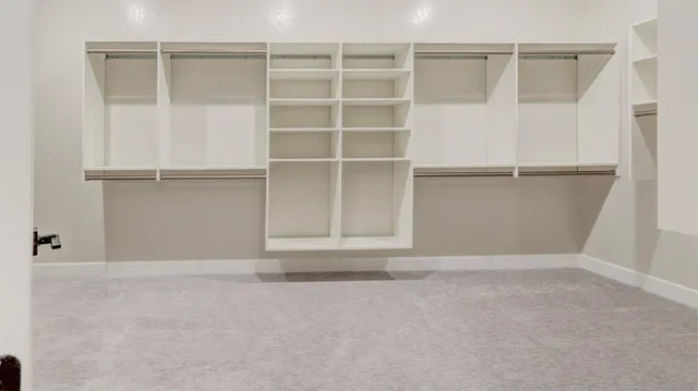 a view of an empty room with cabinet