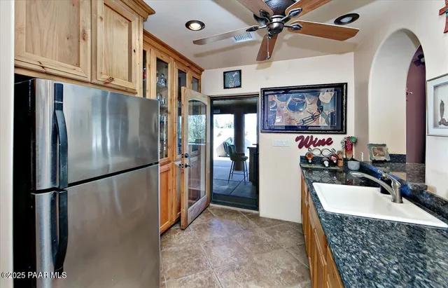 a spacious bathroom with a granite countertop sink and a mirror