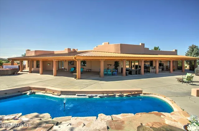 a view of a city with lush green forest