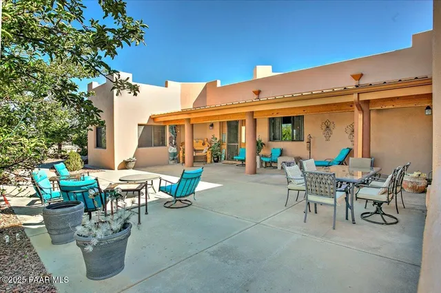 a living room filled with furniture and potted plant