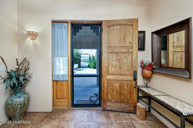 a dining room with furniture and chandelier