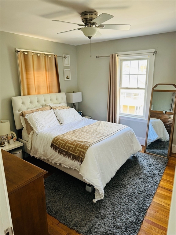 43 Chapman Street, Unit 2 Watertown, MA 02472 - Photo 6 of 12 a bedroom with a bed and window