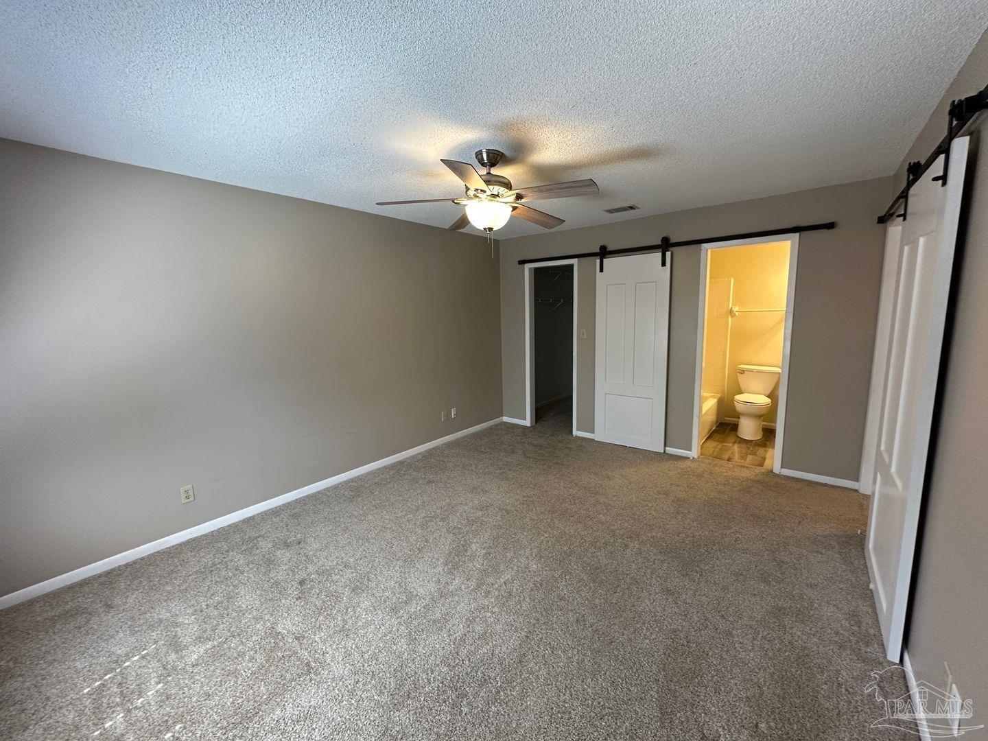 4831 East Olive Road, Unit 4D Pensacola, FL 32514 - Photo 12 of 17 a view of a livingroom with a ceiling fan and window