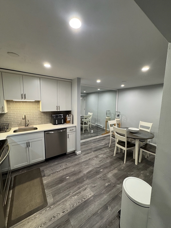 30 Parish Pathe, Unit 30 Marshfield, MA 02050 - Photo 2 of 11 a kitchen with a dining table chairs sink and stove