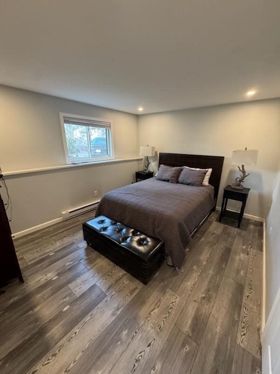 30 Parish Pathe, Unit 30 Marshfield, MA 02050 - Photo 7 of 11 a bedroom with a bed and wooden floor